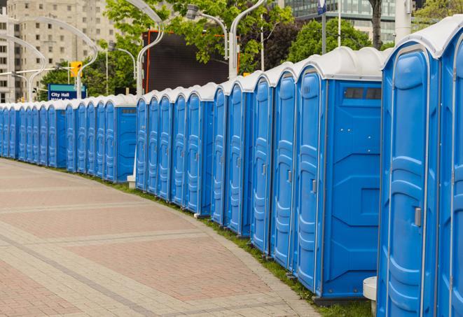 a row of portable restrooms at a fairground, offering visitors a clean and hassle-free experience in Bethel